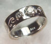 Item# CD16: 14Kt White gold custom engagement ring, 6mm with .34 ct RBC diamond bezel set and two .10ct RBC.