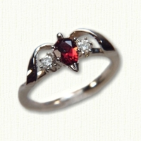 14Kt yellow gold 'Deborah' set with a pear shaped garnet and two side diamonds.