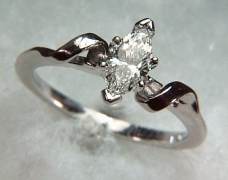 14kt white gold 'Lisa' set with a .49ct marquise cut diamond.